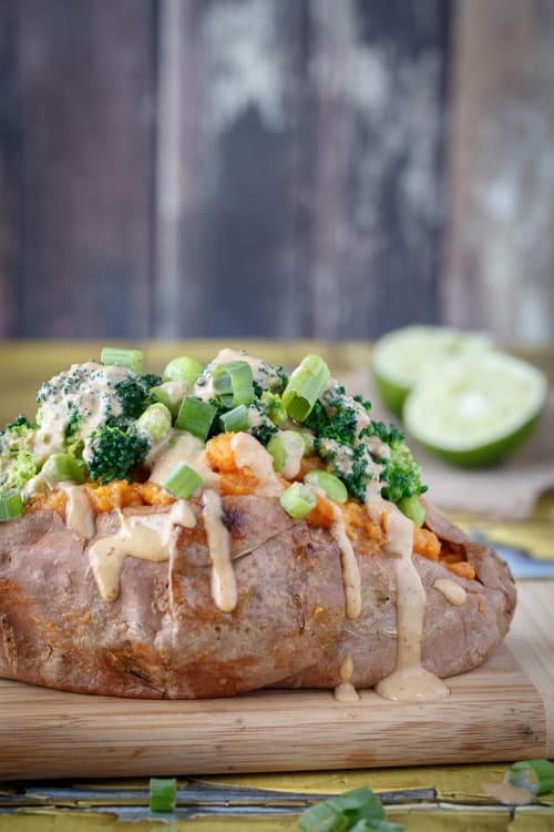 Sweet potatoes stuffed with broccoli, edamame, and thai peanut sauce