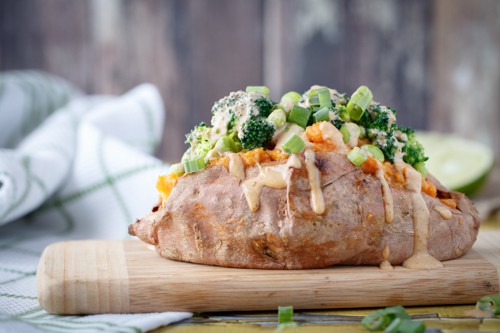 Sweet potatoes stuffed with broccoli, edamame, and thai peanut sauce