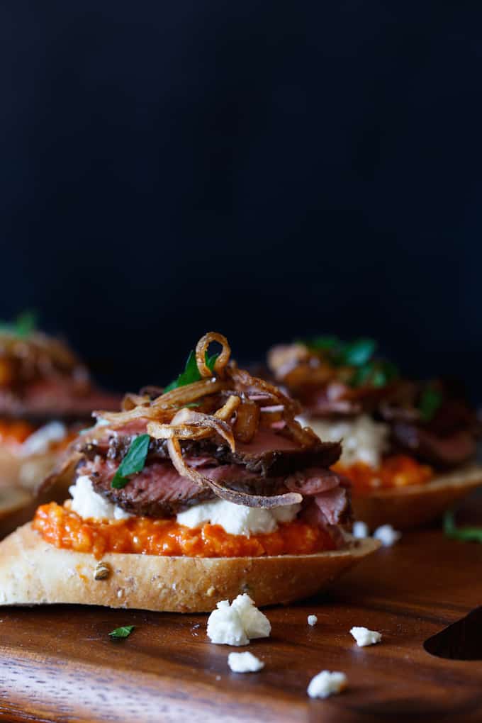 Filet Mignon Crostini with Romesco, Goat Cheese, and Crispy Shallot | sharedappetite.com