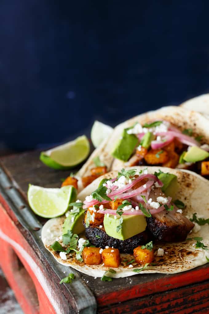 Pork Belly Tacos with Ancho Chili Roasted Pineapple, Avocado, and Pickled Onions | sharedappetite.com