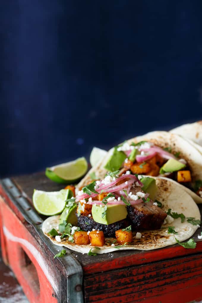 Pork Belly Tacos with Ancho Chili Roasted Pineapple, Avocado, and Pickled Onions | sharedappetite.com