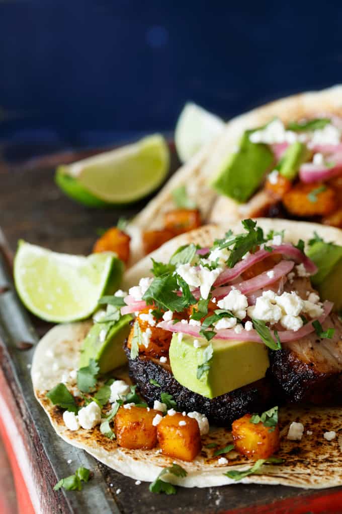 Pork Belly Tacos with Ancho Chili Roasted Pineapple, Avocado, and Pickled Onions | sharedappetite.com