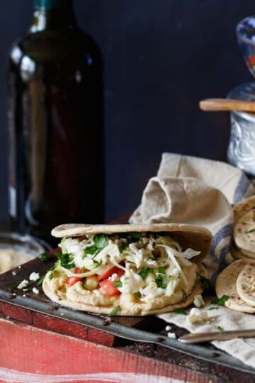 Healthy Mini Vegetarian Greek Sliders with Hummus, Israeli Salad, Pickled Cabbage, and Tahini Sauce | sharedappetite.com