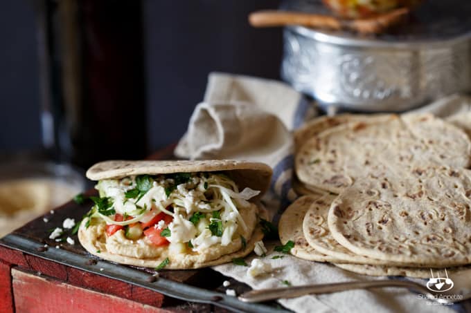 Healthy Mini Vegetarian Greek Sliders with Hummus, Israeli Salad, Pickled Cabbage, and Tahini Sauce | sharedappetite.com