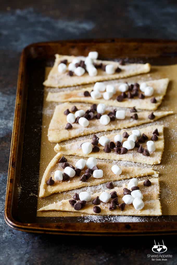 Baked S'mores Churro Bites | sharedappetite.com Ready within 15 minutes, these cinnamon sugar crescent rolls are stuffed with mini marshmallows and chocolate chips!