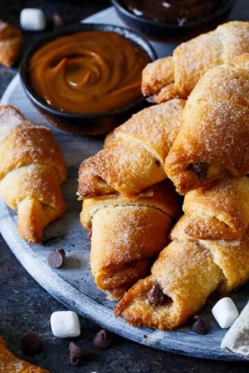 Baked S'mores Churro Bites | sharedappetite.com Ready within 15 minutes, these cinnamon sugar crescent rolls are stuffed with mini marshmallows and chocolate chips!
