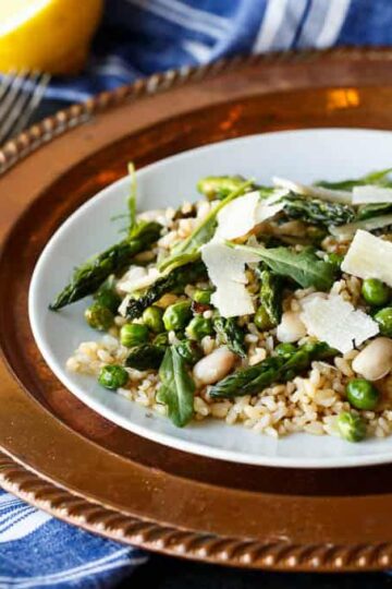 Gluten Free Spring Pea and Asparagus Brown Rice Salad with freshly shaved Parmigiana Reggiano and a bright Lemon Vinaigrette | sharedappetite.com A perfect light and fresh vegetarian meal that's portable and great hot or cold!