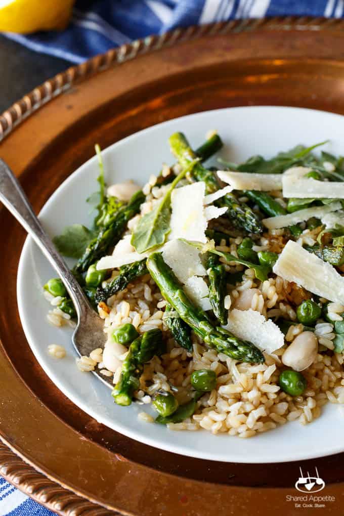 Gluten Free Spring Pea and Asparagus Brown Rice Salad with freshly shaved Parmigiana Reggiano and a bright Lemon Vinaigrette | sharedappetite.com A perfect light and fresh vegetarian meal that's portable and great hot or cold!