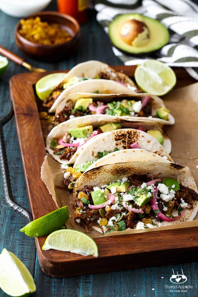 Mexican Lamb Tacos with Tequila Soaked Golden Raisins, Pepitas, and PIckled Onions | sharedappetite.com