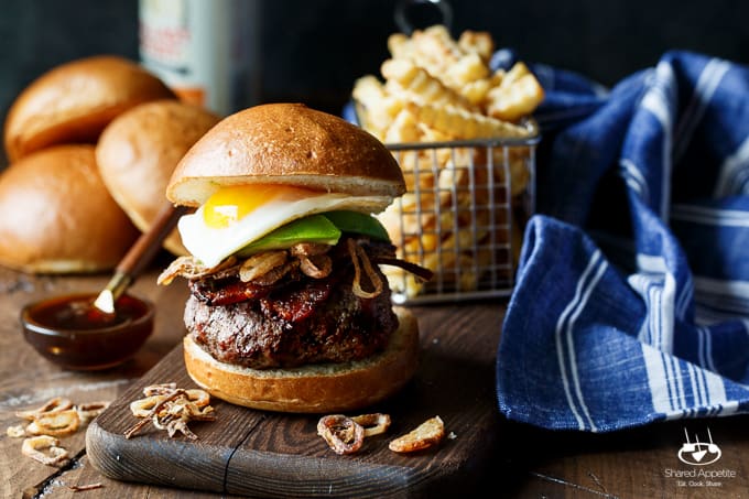 Whiskey Glazed Burgers with Spicy Brown Sugar Bacon, Avocado, Crispy Shallots, and a Fried Egg! A perfect Father's Day EPIC burger | sharedappetite.com