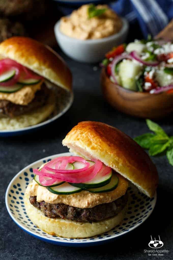 Lamb Kefta Burgers with Spicy Whipped Feta, Pickled Onions, and Cucumber | sharedappetite.com