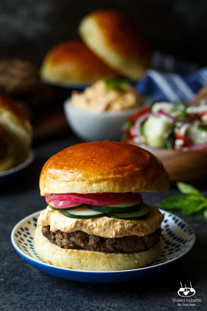 Lamb Kefta Burgers with Spicy Whipped Feta, Pickled Onions, and Cucumber | sharedappetite.com