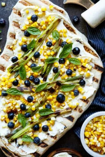 Summer Corn and Blueberry Grilled Pizza with Whipped Goat Cheese and Grilled Scallions. Super quick and easy, perfect for summer easy entertaining! | sharedappetite.com
