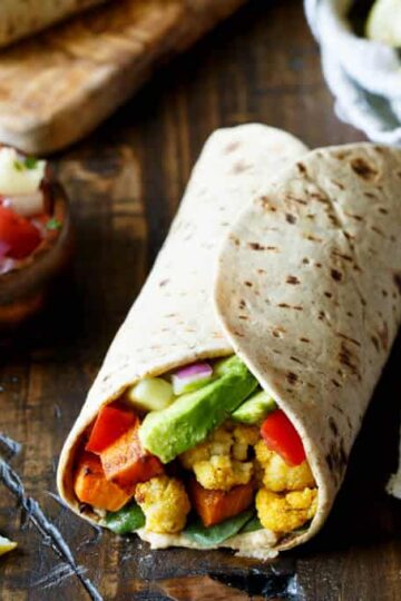 Vegan Curried Cauliflower and Sweet Potato Wrap with Hummus, Avocado, and Israeli Salad | sharedappetite.com