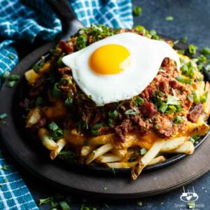 Loaded Pulled Pork Cheese Fries with a Fried Egg | sharedappetite.com