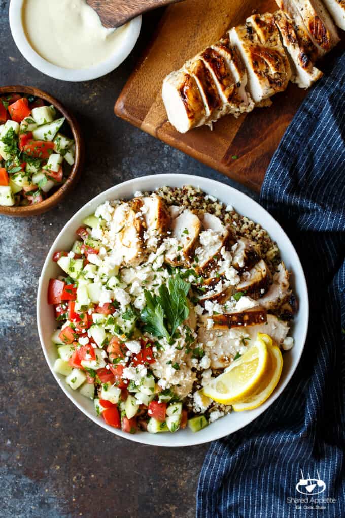 Mediterranean Chicken Quinoa Bowls with Israeli Salad, Hummus, and Tahini Sauce | sharedappetite.com