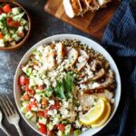 Mediterranean Chicken Quinoa Bowls with Israeli Salad, Hummus, and Tahini Sauce | sharedappetite.com