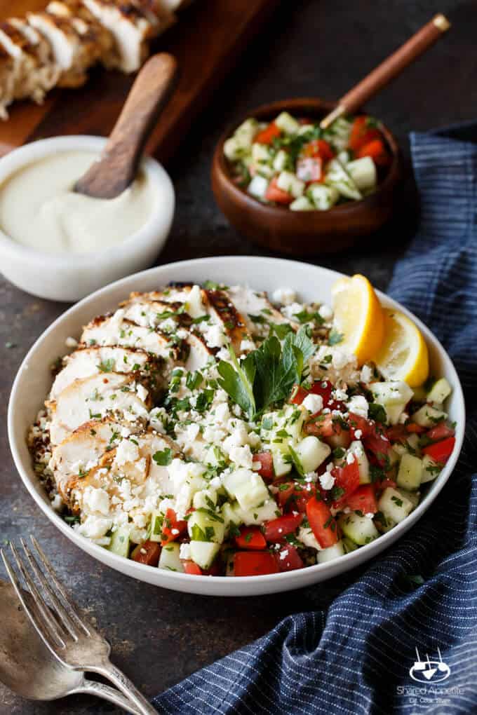 Mediterranean Chicken Quinoa Bowls with Israeli Salad, Hummus, and Tahini Sauce | sharedappetite.com