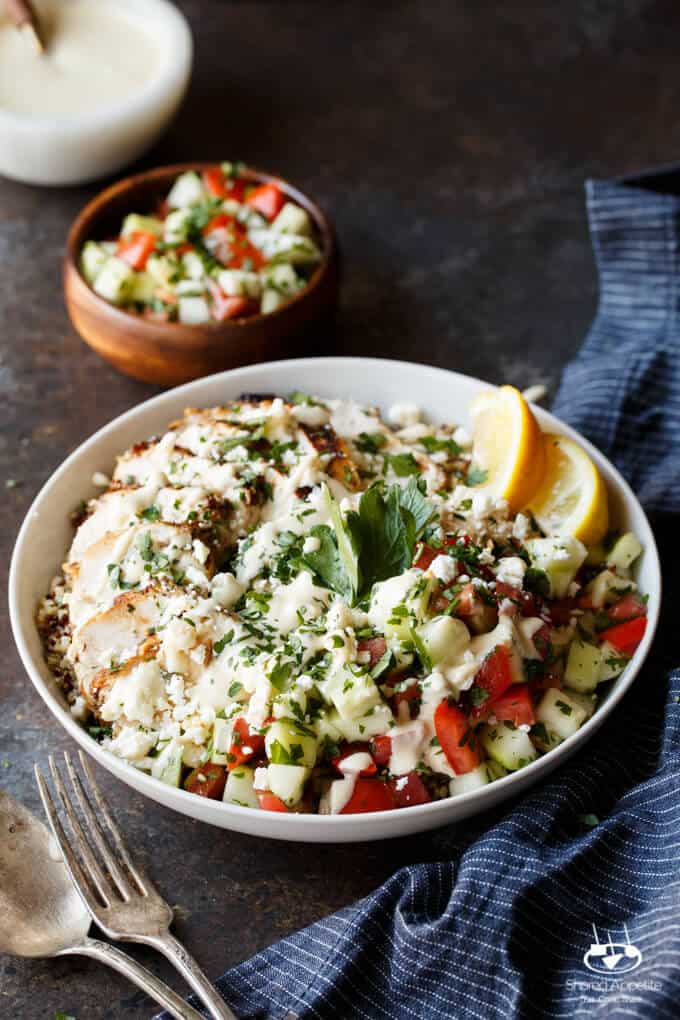 Mediterranean Chicken Quinoa Bowls with Israeli Salad, Hummus, and Tahini Sauce | sharedappetite.com