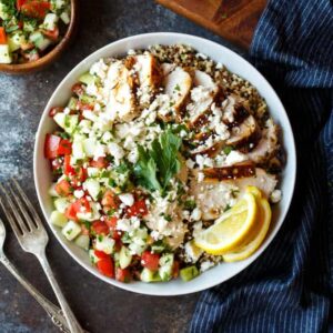 Mediterranean Chicken Quinoa Bowls with Israeli Salad, Hummus, and Tahini Sauce | sharedappetite.com