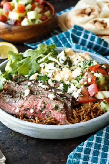 Grilled Flank Steak Shawarma Bowls with Israeli Salad, Hummus, and White Sauce | sharedappetite.com