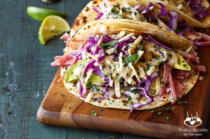 Slow Cooker Corned Beef Tacos Guinness Braised with Guinness Cream Sauce, Red Cabbage, and Avocado | sharedappetite.com