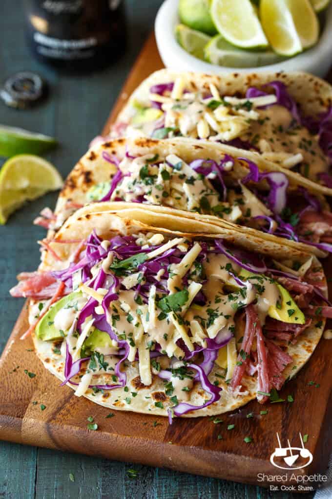 Slow Cooker Corned Beef Tacos Guinness Braised with Guinness Cream Sauce, Red Cabbage, and Avocado | sharedappetite.com