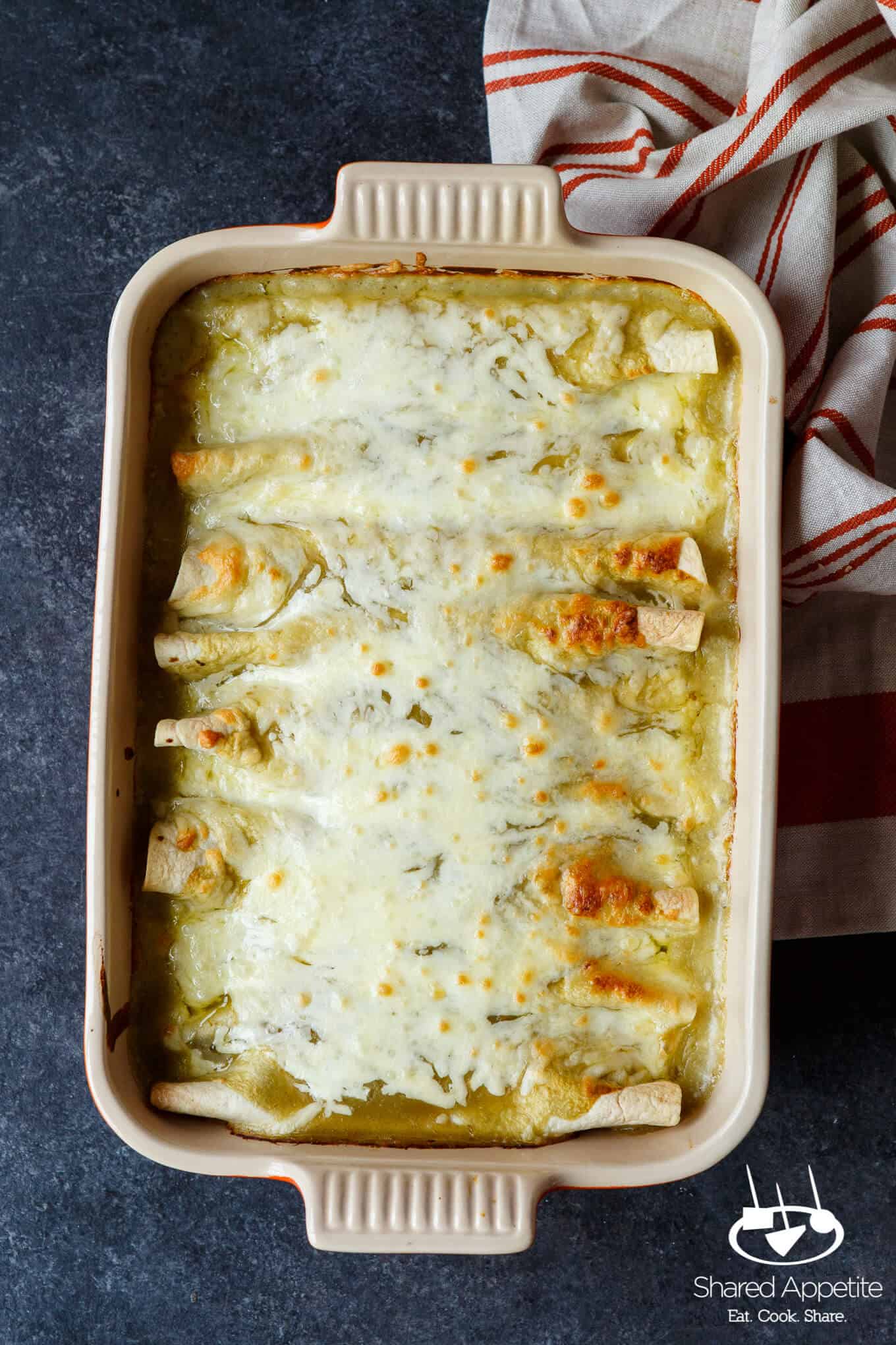 Hidden Veggie Chicken Enchiladas with Zucchini, Spinach, and Corn in a Green Chile Sauce are Family Friendly! | sharedappetite.com