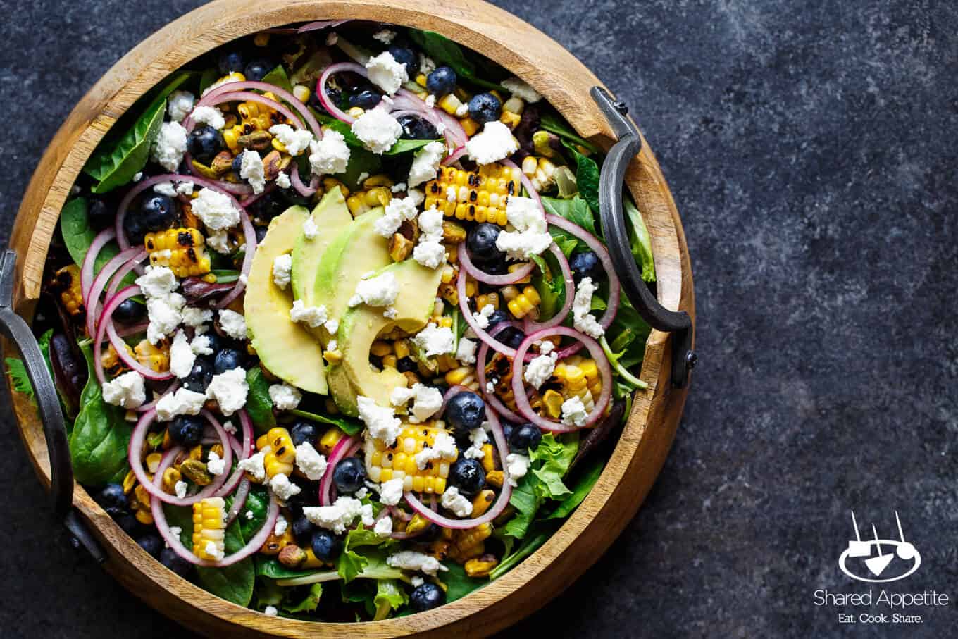 Blueberry, Corn, and Goat Cheese Salad with quick pickled onions, avocado, pistachios, and a bright lemon vinaigrette | sharedappetite.com