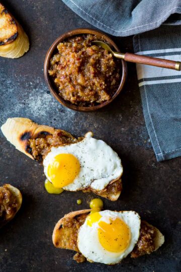 Bacon Jam made with onions, bacon, and apple juice! The perfect condiment for avocado toast, burgers, and goes great with eggs! Full recipe on sharedappetite.com