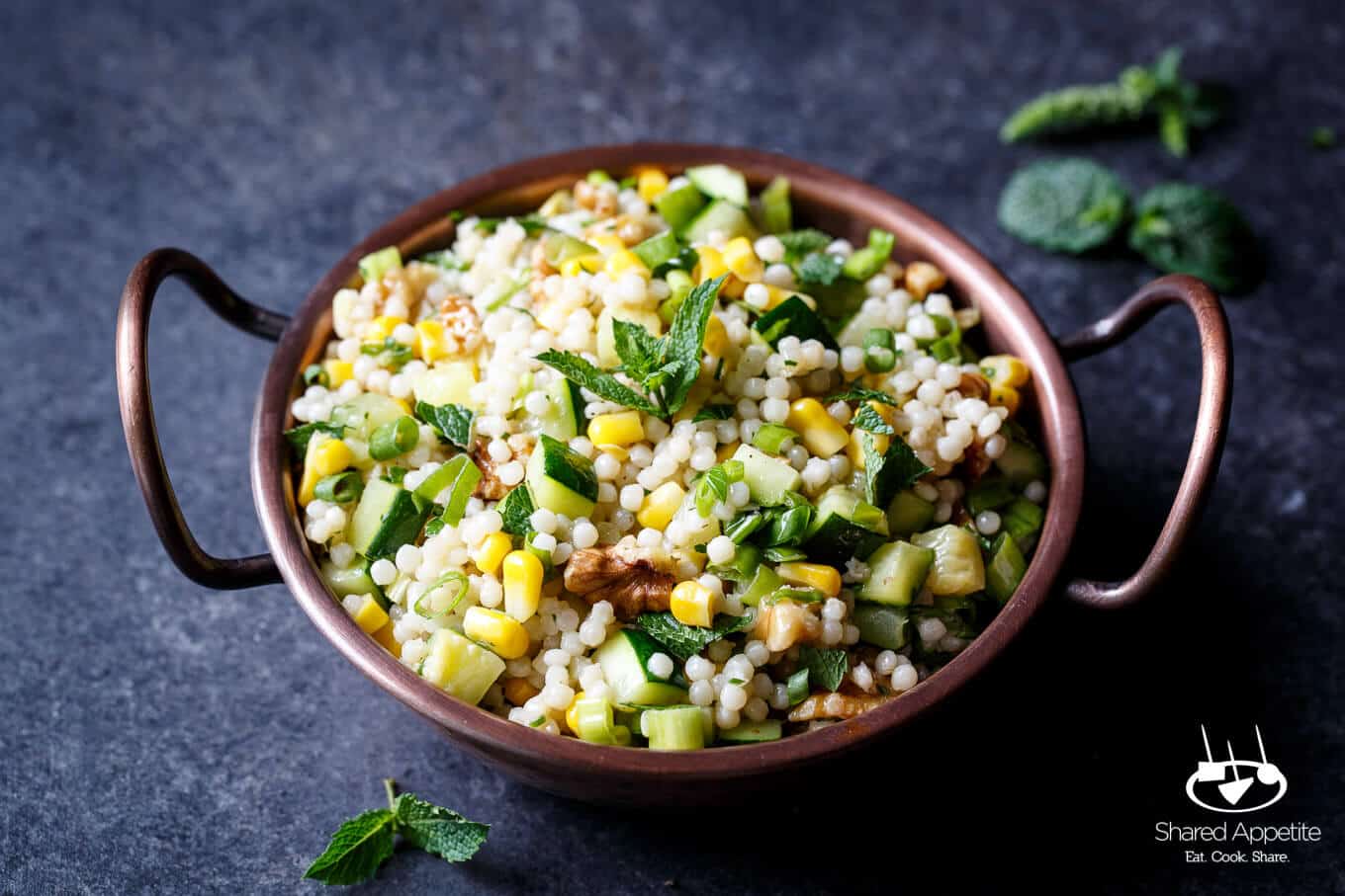 Pearl Couscous Salad with Zucchini, Corn, and Mint to serve as a side to Grilled Lamb Chops with Mint Chimichurri | sharedappetite.com