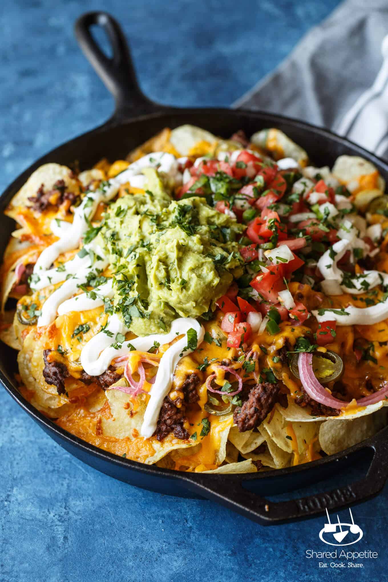 A closeup of the Skillet Loaded Taco Potato Chip Nachos | sharedappetite.com