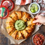 Grabbing a slice of the Chicken Enchilada Crescent Ring | sharedappetite.com