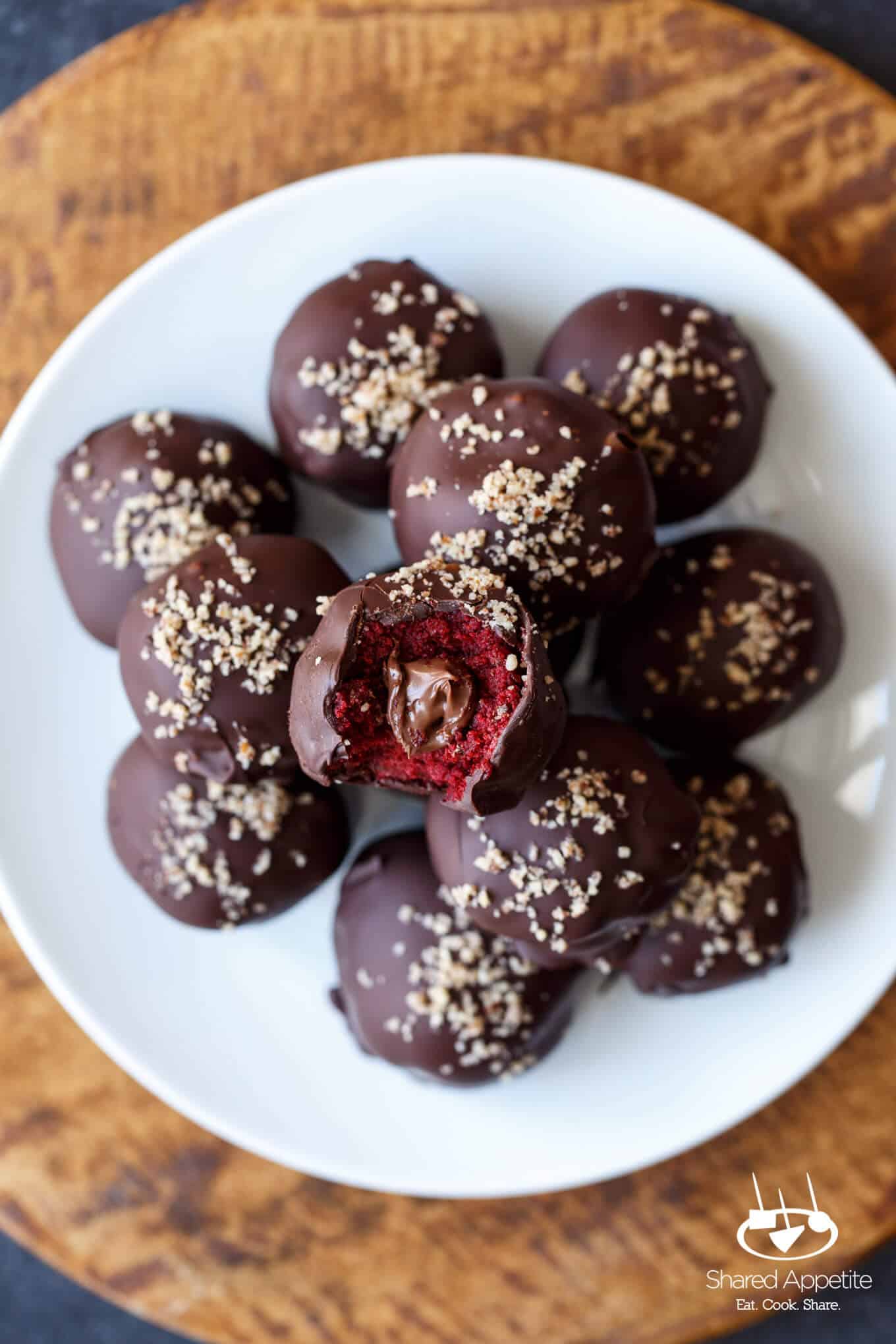 close up of the inside of Nutella Filled Red Velvet Cake Truffles | sharedappetite.com