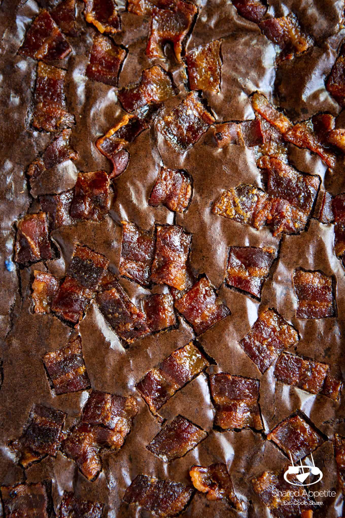 up close view of Candied Bacon Brownies for Candied Bacon Brownie Sundaes with Whiskey Caramel Sauce | sharedappetite.com