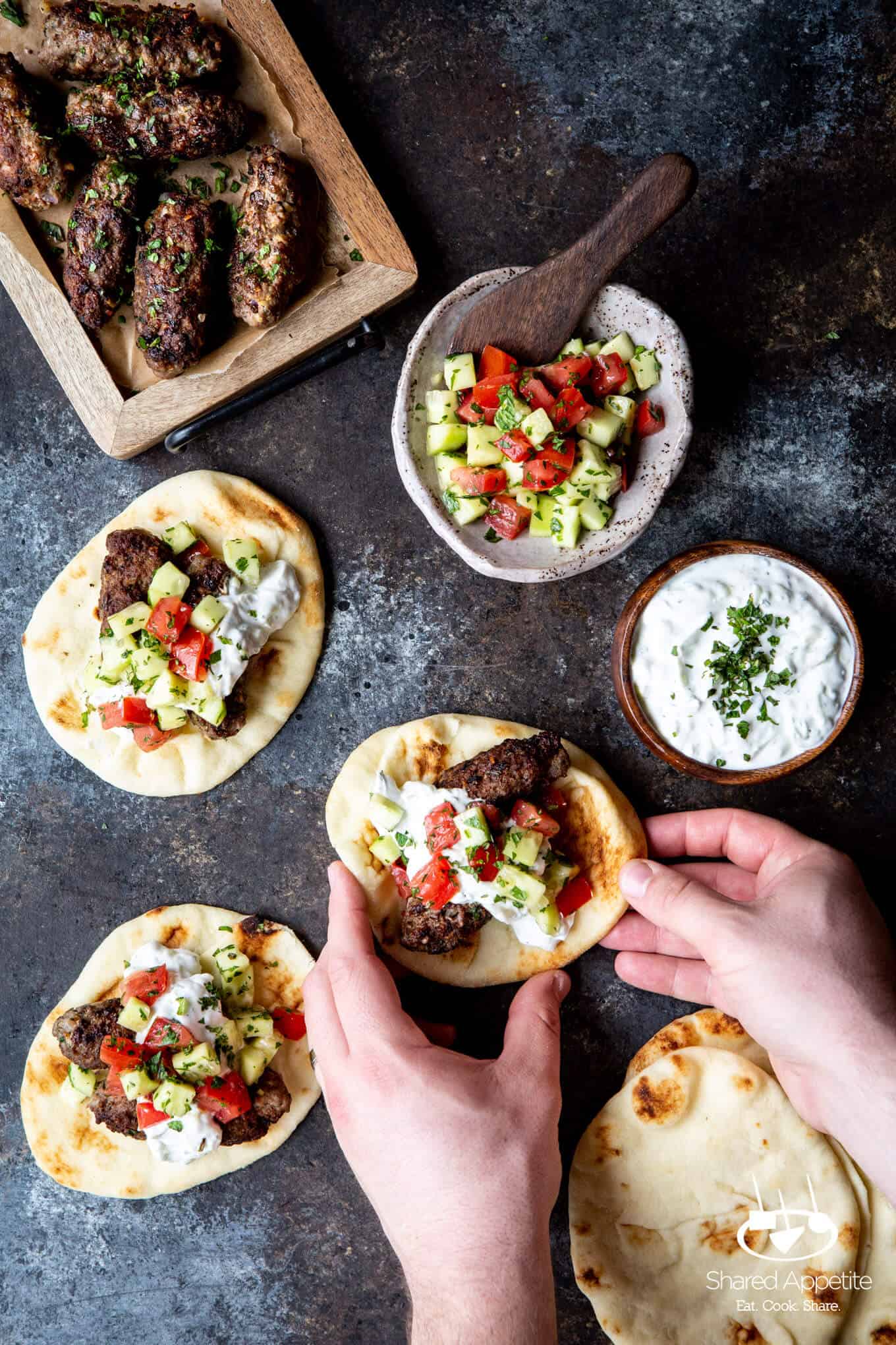 grabbing one of these Greek Lamb Tacos | sharedappetite.com