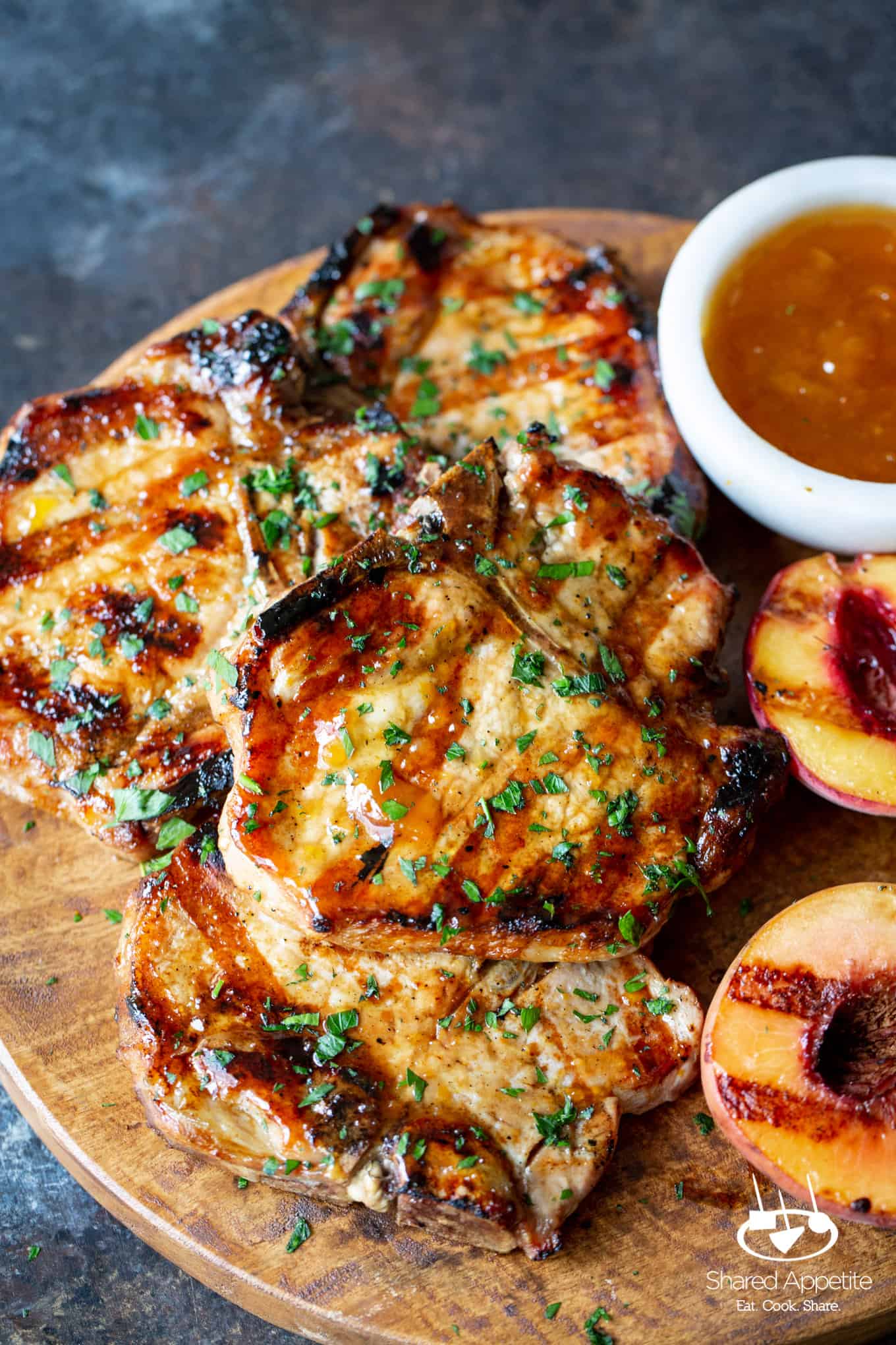 up close shot of these Peach Bourbon Glazed Pork Chops | sharedappetite.com