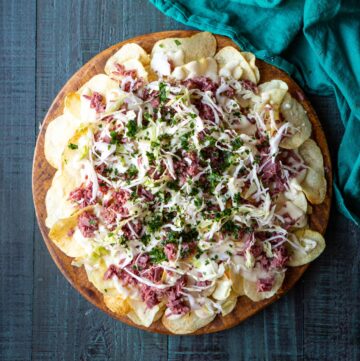 Irish Corned Beef Nachos with Swiss Cheese Queso and Pickled Cabbage for St. Patrick's Day | sharedappetite.com