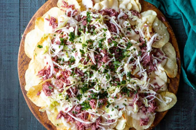 Irish Corned Beef Nachos with Swiss Cheese Queso and Pickled Cabbage for St. Patrick's Day | sharedappetite.com