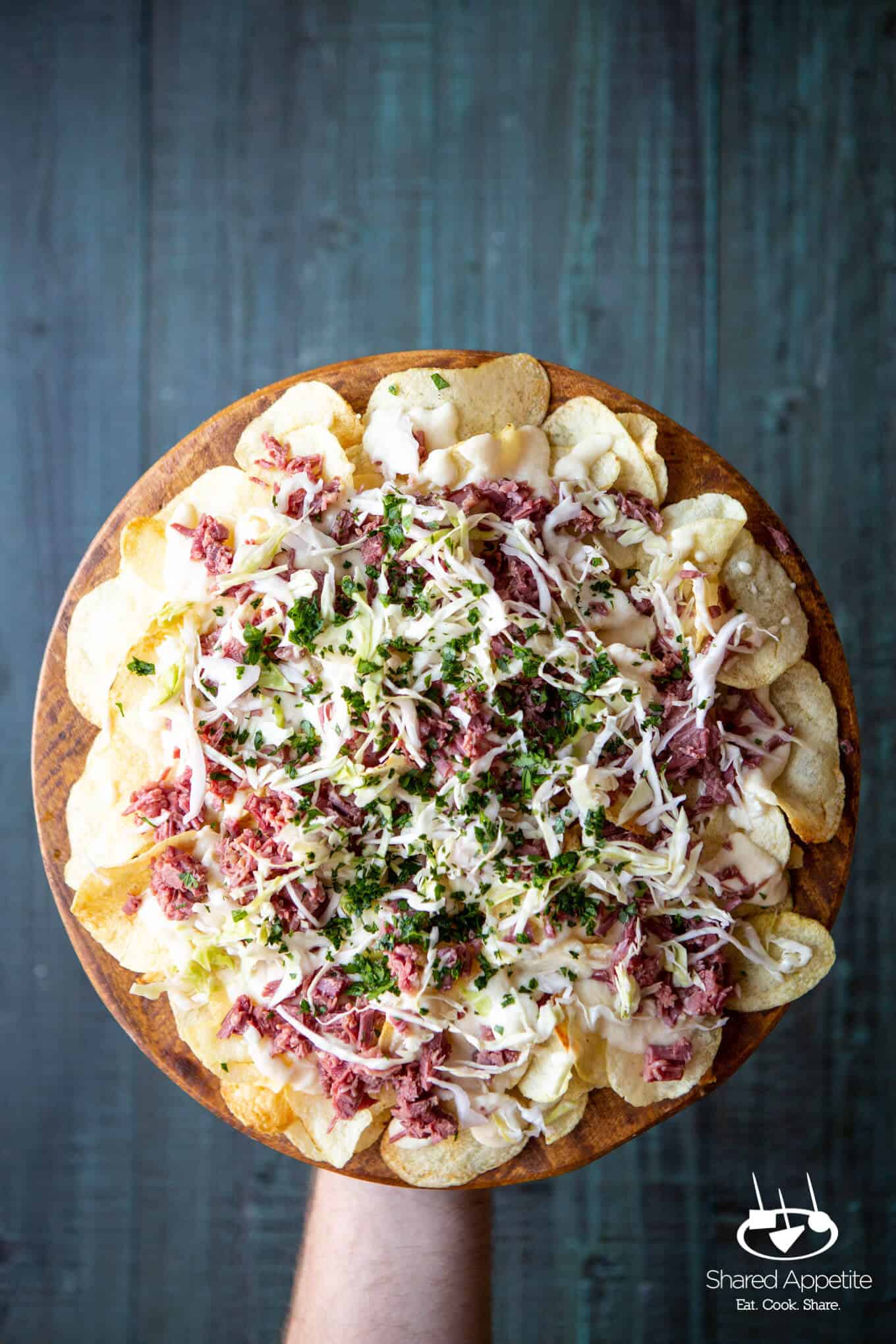 Irish Corned Beef Nachos with Swiss Cheese Queso and Pickled Cabbage for St. Patrick's Day | sharedappetite.com