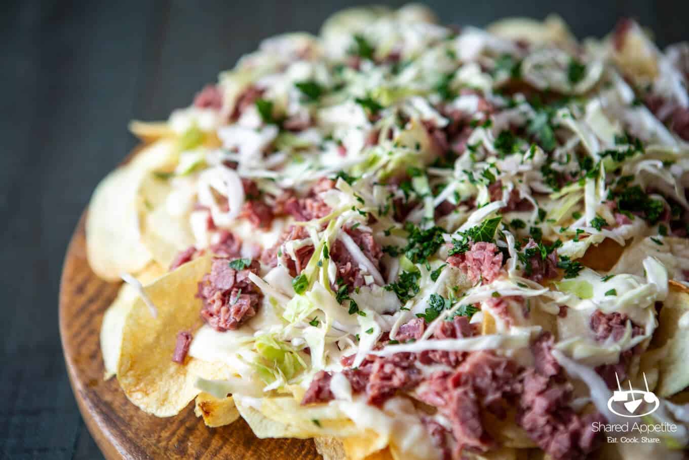 Irish Corned Beef Nachos with Swiss Cheese Queso and Pickled Cabbage for St. Patrick's Day | sharedappetite.com